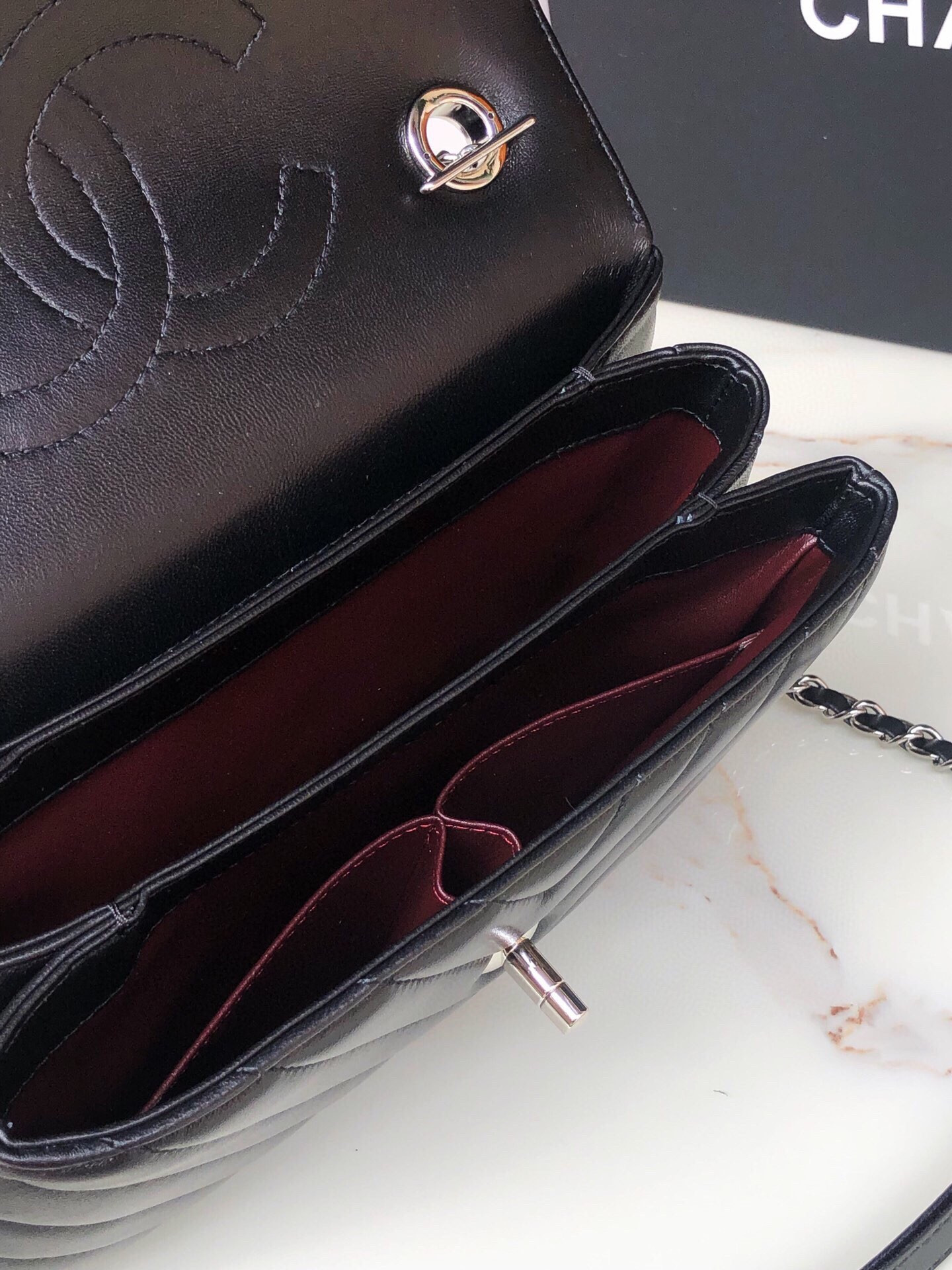 Ch*el flap bag with top handle 6.6 × 9.8 × 4.7 in