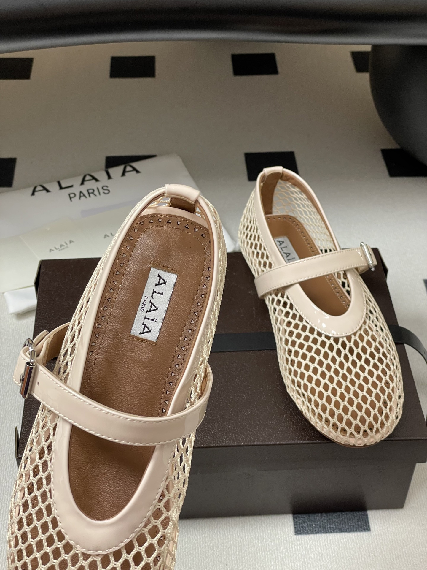 UA ALAÏA BALLET FLATS IN FISHNET